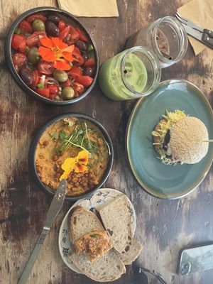 kosmos burger, hummus, tomato salad, brown ice and green ice cream  at Cafe Kosmos in Odense