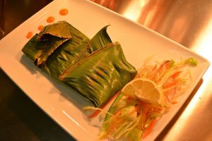 Mushrooms wrapped in banana leaf and cooked on grill.. at Anjanaas in North West London
