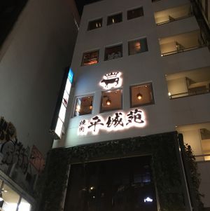 looking up at building from street level  at Umi Cafe in Tokyo