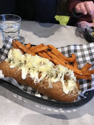 Dachshund hot dog with sweet potato fries at Dogma Cronulla in Cronulla