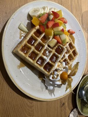 "All-in” waffles with maple syrup. The vegan whip cream was soooo good!  at Green Leaf Cafe in Erding