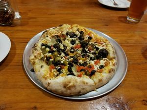 garden pizza with vegan cheese added at Woodfire Cafe in Riverside