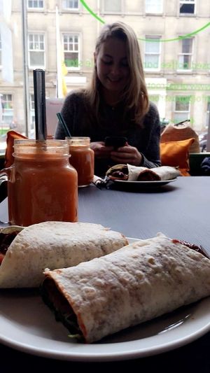 BBQ pulled seitan wrap with my sunset orange juice at Grassroots Health in Edinburgh