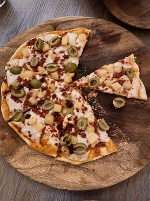 Large pizza with soy chorizo, olives, pineapple and vegan cheese   at La Matatena Pizzeria in Oaxaca