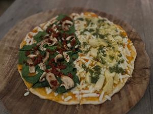 I did a half and a half. One side is spinach, chorizo and mushroom (needed sea salt) Lighter side is artichoke and pesto - not bad. Both had the vegan cheese which is an upcharge.  at La Matatena Pizzeria in Oaxaca