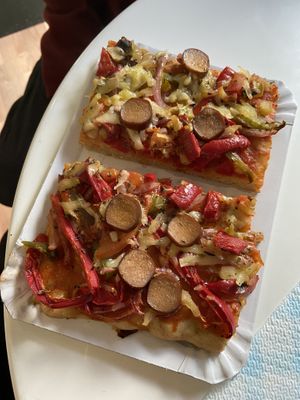 Pizza slice split in two at Alice in Wonder Pie in Santiago De Compostela