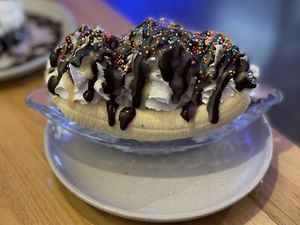 The vegan banana split, with coconut ice cream and coconut whipped cream. A big serving,  enough food for two people to share after a meal.  at Veg Bar in North Hobart