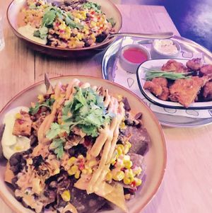 Mexicali bowl, nachos with pulled jackfruit, cauliflower buffalo wings at Veg Bar in North Hobart