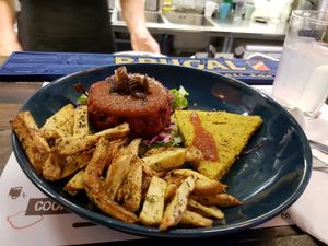 Beetroot burger with polenta and fries  at Marta's Veggie Fusion in Split
