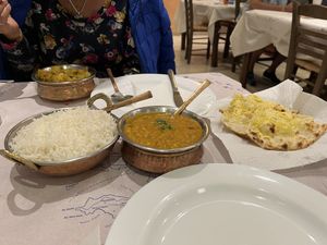 Dal tarka, aloo gobi, boiled rice, and garlic naan  at Jaipur Palace in Santorini