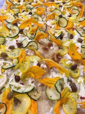 Pinsa with ricotta ,flower of zucchini,zucchini,olives ... at Pinsa & Co in The Hague