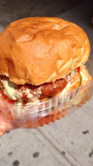 Burger with fried mac and cheese patty  at Orchard Grocer in New York City