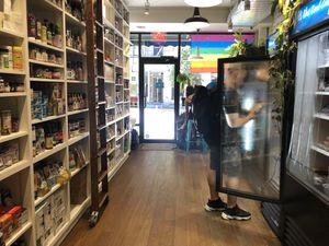 Small store, two to four bar counter seats in the back at Orchard Grocer in New York City