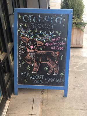 Cute sign outside  at Orchard Grocer in New York City