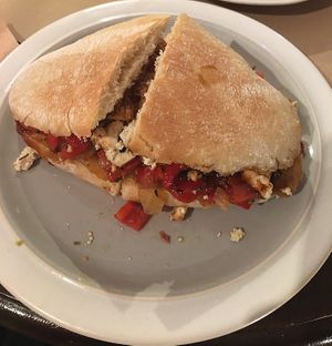 Delicious vegan sandwich with tofu & roasted bell pepper + caramelized onions at La Inquilina in Madrid