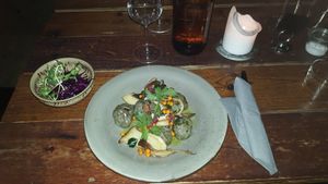Kroppkakor med aktivt kol samt svamp, havtorn och rödkål vid sidan. / Potato balls with mushrooms, buckthorn and red cabbage on be side at Mineral in Malmo