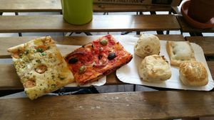 Pizzas and buns thingys at Fill Good in Budapest