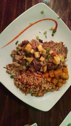 Vegan Jackfruit Cakes w/ seasonal vegetables & roasted red pepper coconut cous cous at Kitchen 519 in Glendora