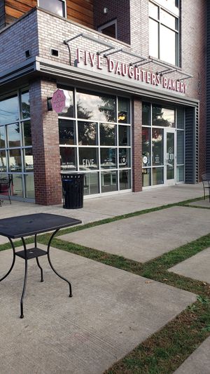 Store front in a center with 8ce cream store near by at Five Daughters Bakery - Eastland Ave in Nashville