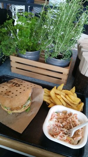 Schnitzel burger, coleslaw and chips at Swing Kitchen - Josefstadt in Vienna