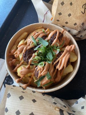 Chick’ n frittes (falafel veg balls on fries with gorgeous Charlie bbq sauce)   at Swing Kitchen - Josefstadt in Vienna