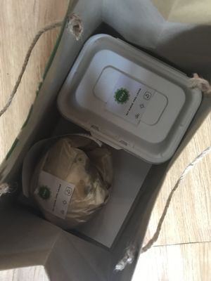 Packaging.
Burger wrapped in paper and fries in a compostable container. at House Of Chay in Ho Chi Minh City