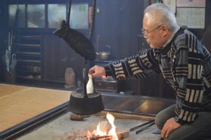 Masa san warming our sake at Koshinzuka in Nagano