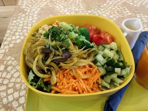 Huge raw vegan salad with so many tasty vegetables inside! at World Food Barn in Paris