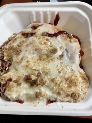Vanilla frosting, raspberry jam, pie crumble  at Cinnaholic in Meridian