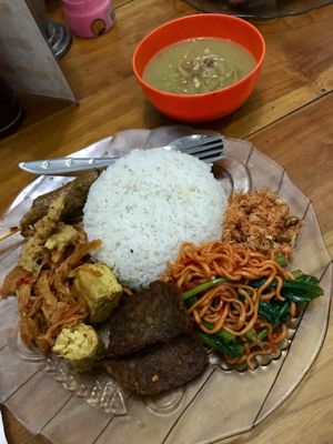 Nasi Campur with different sauces and yummy treats and a bowl of soup. Very spicy but tasty! And for only 15,000 IDR! at Rama Vegetarian in Ubud