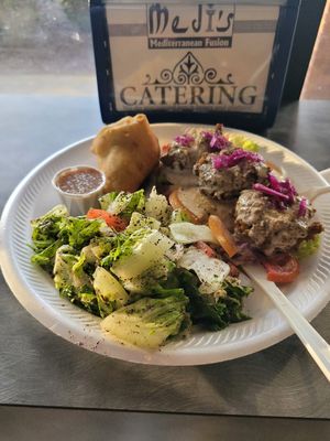 Falafel bowl with side of samosa at Medi's Mediterranean Fusion Restaurant in Macon