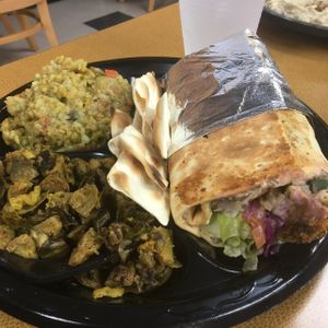 falafel roll with hummus and tabouleh, curry Brussels sprouts, mixed vegetable birnyani  at Medi's Mediterranean Fusion Restaurant in Macon