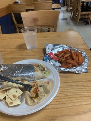 Falafel wrap with hummus and sweet potato fries  at Medi's Mediterranean Fusion Restaurant in Macon