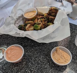 Fried Brussel Sprouts (be sure to ask for vegan sauces )  at Zombie Burger in Des Moines