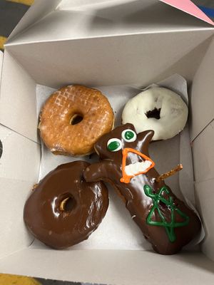 Raised glazed, lemonade, chocolate glazed, voodoo doll  at Voodoo Doughnut in Universal City