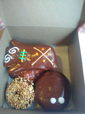 Voodoo, peanut, Bavarian and apple fritter at Voodoo Doughnut in Universal City