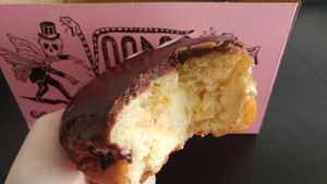 The indistinguishable Vegan Portland Cream. So hard to photograph, but I promise the custard was amazing! And the chocolate icing was also really good! at Voodoo Doughnut in Universal City