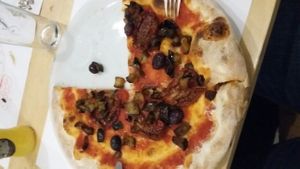 pizza with eggplant, sundried tomatoes and olives  at Olio Doliva in Sofia