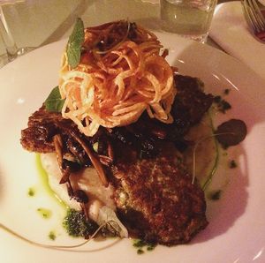 Mung bean & cauliflower patties served with chantarelles, artichoke puree and potato swirls.  at Bistro Bananas in Stockholm