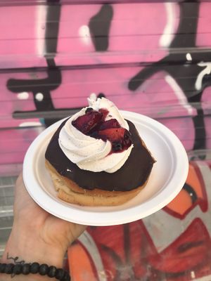Vegan cream filled donut with chocolate, cream and strawberries  at Chök in Barcelona