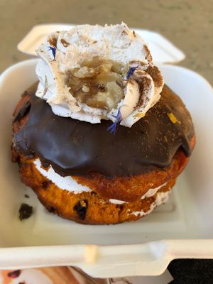 Pumpkin donut with vanilla cream filling and chocolate topping  at Chök in Barcelona