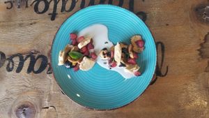 Dessert with fruit/berries and cookie pieces at Inspiracion 9 in Tijuana