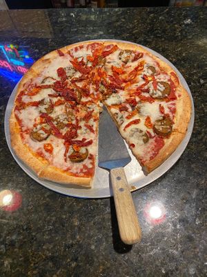 House made pepperoni with Follow Your Heart mozzarella and sun dried tomatoes    at Summit Pizza in Lees Summit