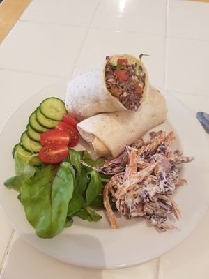 Black bean and avacado wrap with side salad and slaw. Delicious! at Johnny V's in Gosport