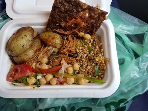 onion bread, rosemary potatoes, buckwheat salad, singapore noodles & chickpea sala at Natural Bar & Kitchen in Birmingham