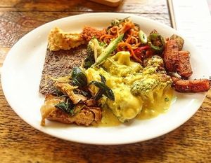 Buffet-based pay-by-weight vegan food. Onion bread, raw stir fry, cauliflower cheese, hummus,  at Natural Bar & Kitchen in Birmingham