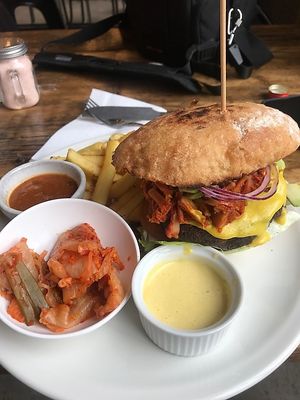freakin amazing Vegan Burger with "mayo" , Hot sauce and vegan Kimchi  at Natural Bar & Kitchen in Birmingham