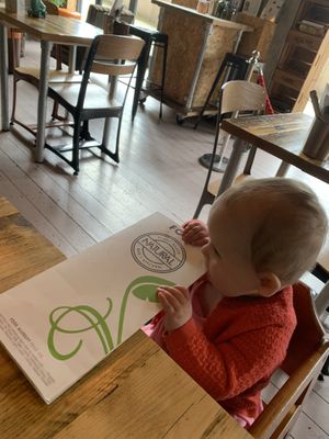 So excited about her food she felt the need to eat the menu   at Natural Bar & Kitchen in Birmingham