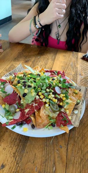 vegan nachos- sensationally smashing! all flavours perfectly compliment each other as you indulge in this cheesy and guacamoley goodness:))))))) at Natural Bar & Kitchen in Birmingham