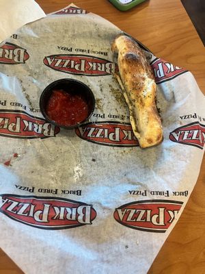 This was the 4 garlic sticks with vegan Parmesan   at BRK Pizza in Naples